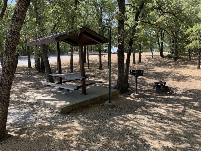 A photo of Site 069 of Loop HICKORY CREEK  at HICKORY CREEK with Boat Ramp, Picnic Table, Electricity Hookup, Fire Pit, Shade, Lantern Pole, Water Hookup