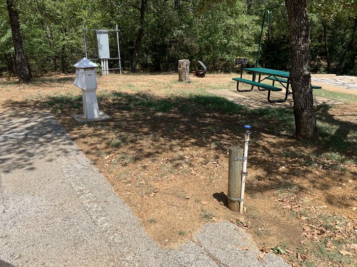 A photo of Site 118 of Loop HICKORY CREEK at HICKORY CREEK with Boat Ramp, Picnic Table, Electricity Hookup, Fire Pit, Shade, Lantern Pole, Water Hookup