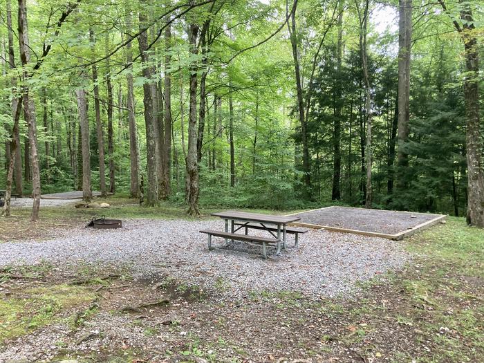 A side photo of Site A13 of Loop A-Loop at COSBY CAMPGROUND with Picnic Table, Fire Pit, Tent PadA closer, somewhat of a side view of the side