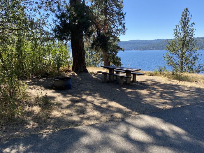A photo of Site 015 of Loop Lower at BELL BAY CAMPGROUND with Picnic Table, Fire Pit, Shade