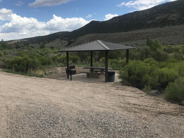 A photo of Site 6 at Hanging Rock Campground with Picnic Table & Shade Shelter