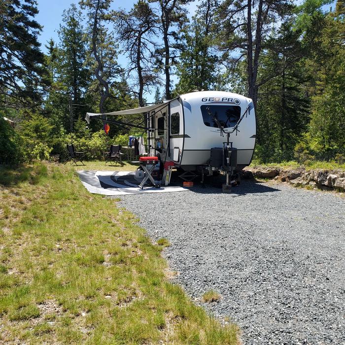 Site 08 with RV view from streetA photo of Site A08 of Loop A-Loop at Schoodic Woods Campground with Picnic Table, Electricity Hookup, Fire Pit