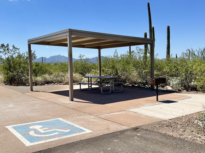 A photo of an accessible RV site at TWIN PEAKS CAMPGROUND with Picnic Table, ShadeAn ADA accessible RV site.
