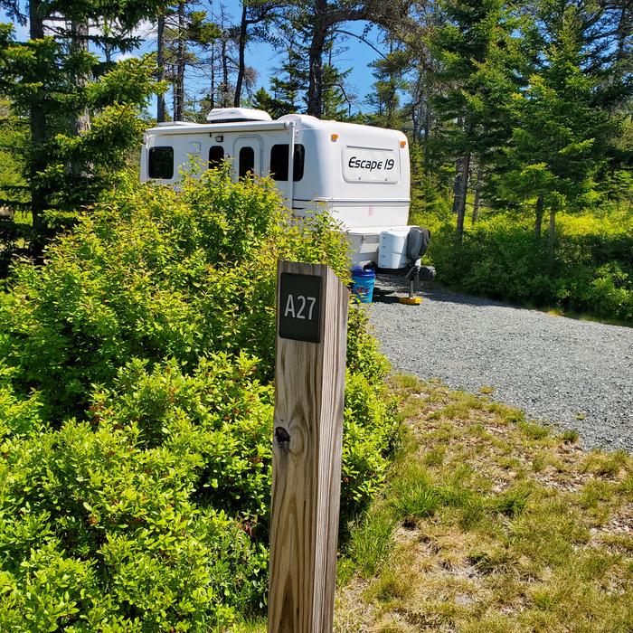 A photo of Site A27 of Loop A-Loop at Schoodic Woods Campground with Picnic Table, Electricity Hookup, Fire Pit