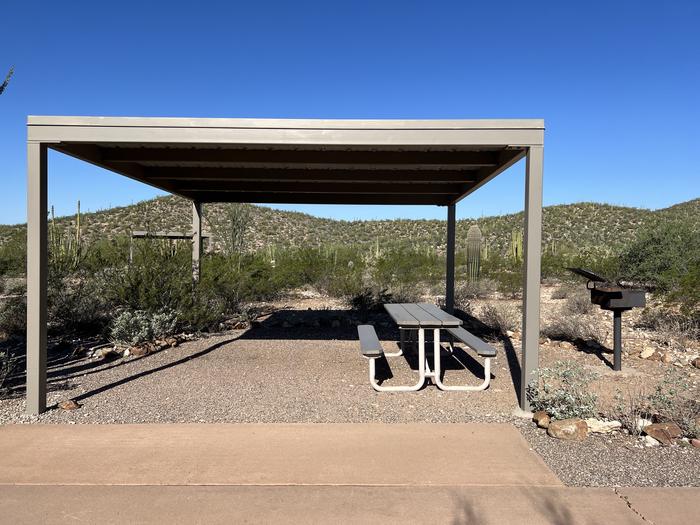 A photo of Site 001 of Loop RV Generator at TWIN PEAKS CAMPGROUND with Picnic Table, Shade, Lean To / Shelter