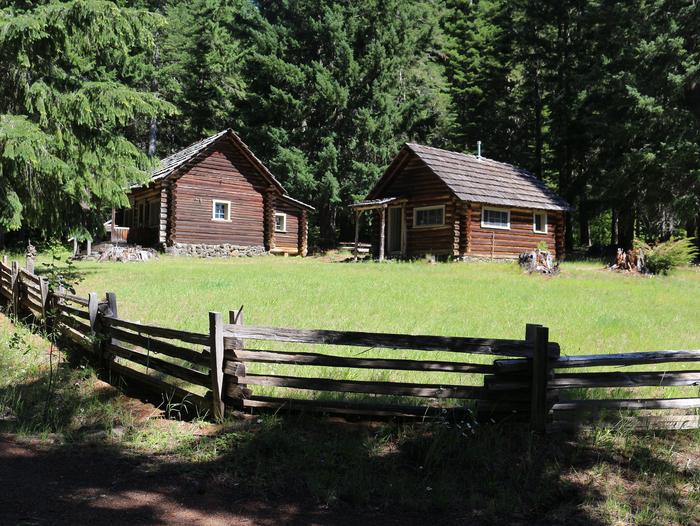 The Dispatcher's Cabin on the left and the Commissary Cabin on the right in summer.The Commissary Cabin (right) in summer.