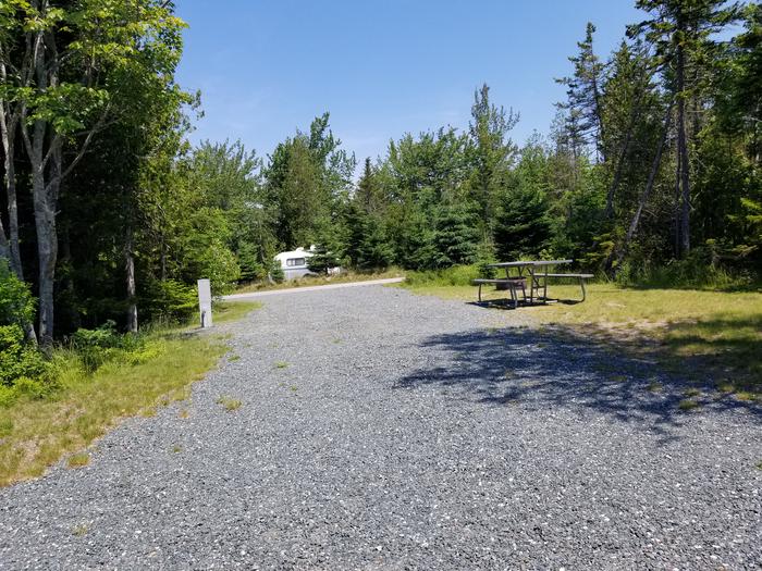 Site B12 of Loop B-Loop at Schoodic Woods Campground with Picnic Table, Electricity Hookup, Fire Pit, Water HookupA photo of Site B12 of Loop B-Loop at Schoodic Woods Campground with Picnic Table, Electricity Hookup, Fire Pit, Water Hookup