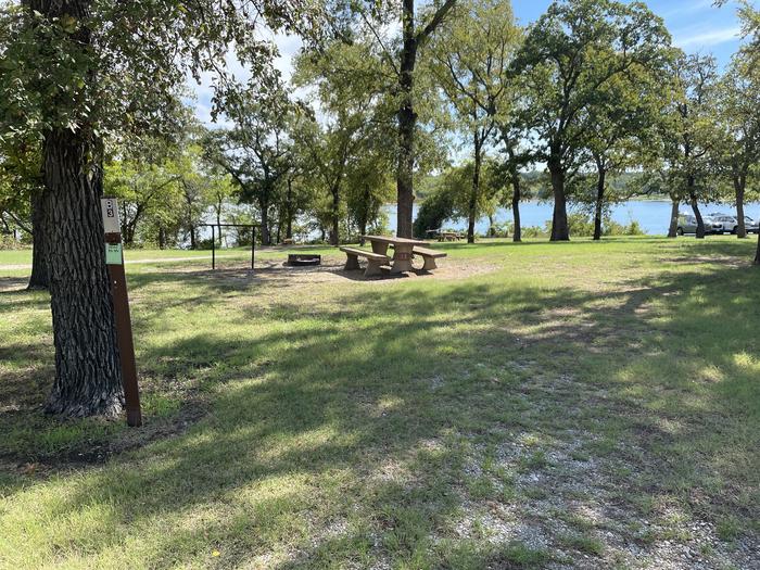 A photo of Site B03 of Loop B at CANEY CREEK with Picnic Table, Fire Pit, Shade
