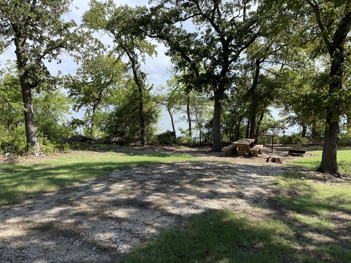 A photo of Site B08 of Loop B at CANEY CREEK with Picnic Table, Fire Pit, Shade, Waterfront