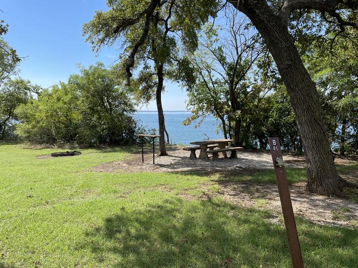 A photo of Site B01 of Loop B at CANEY CREEK with Picnic Table, Fire Pit, Shade, Waterfront