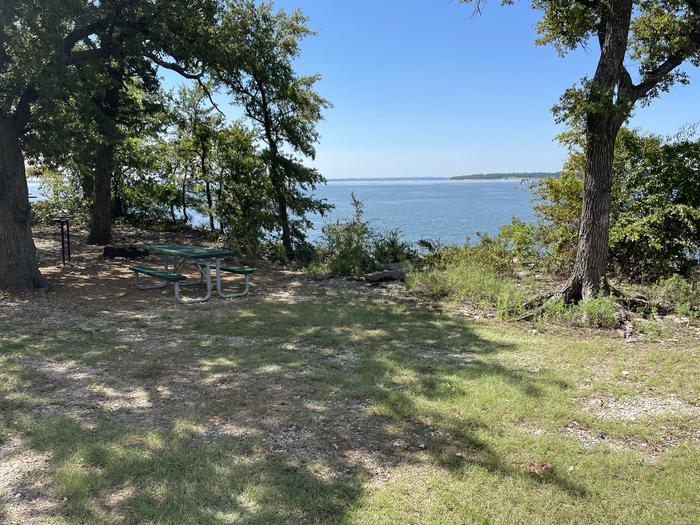 A photo of Site B04 of Loop B at CANEY CREEK with Picnic Table, Fire Pit, Shade, Waterfront