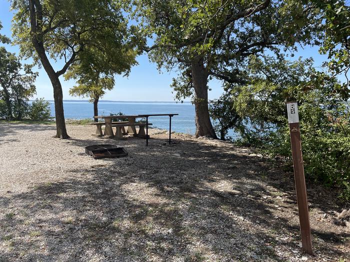 A photo of Site B05 of Loop B at CANEY CREEK with Picnic Table, Fire Pit, Shade, Waterfront