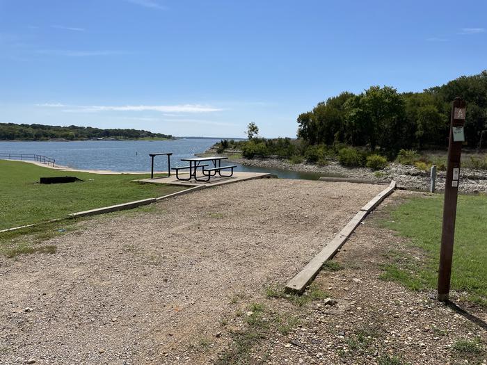 A photo of Site A21 of Loop A at CANEY CREEK with Picnic Table, Electricity Hookup, Fire Pit, Waterfront, Water Hookup