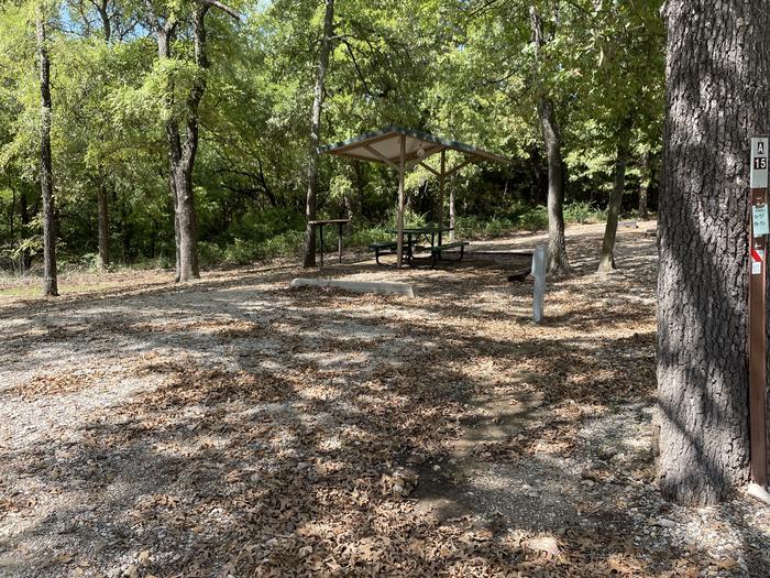 A photo of Site A15 of Loop A at CANEY CREEK with Picnic Table, Electricity Hookup, Fire Pit, Shade, Water Hookup