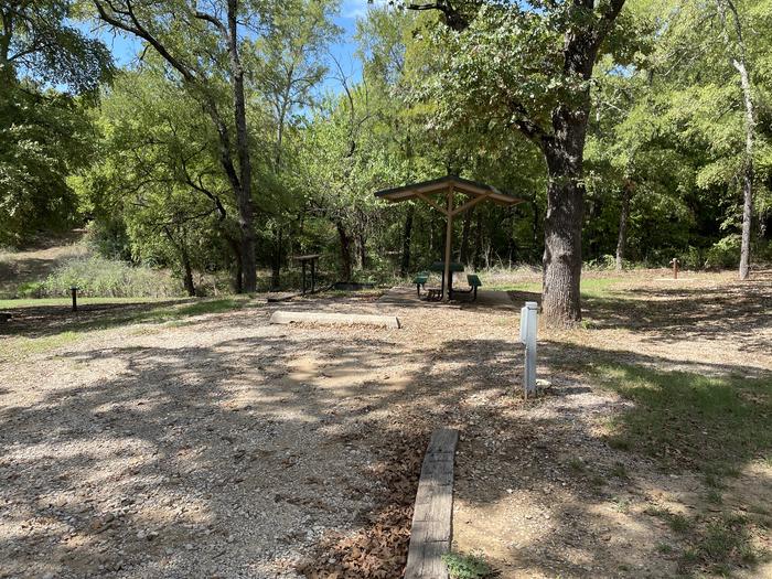 A photo of Site A16 of Loop A at CANEY CREEK with Picnic Table, Electricity Hookup, Fire Pit, Shade, Water Hookup