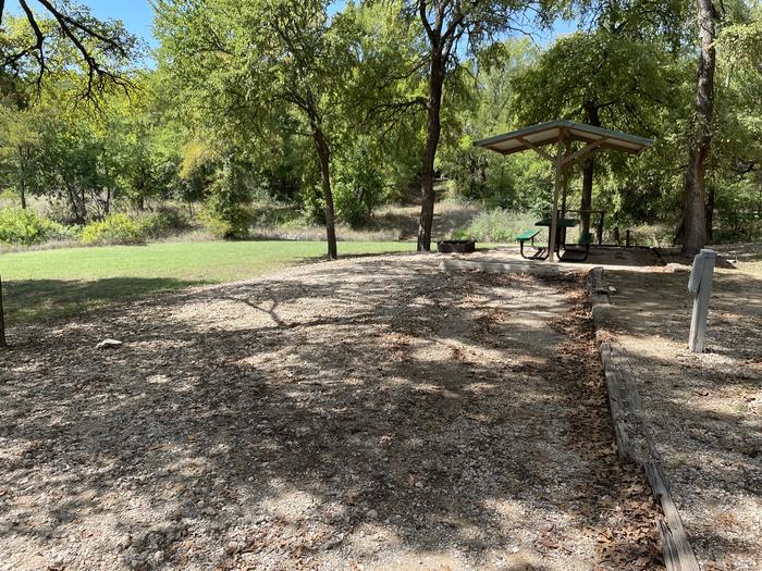 A photo of Site A17 of Loop A at CANEY CREEK with Picnic Table, Electricity Hookup, Fire Pit, Shade, Water Hookup