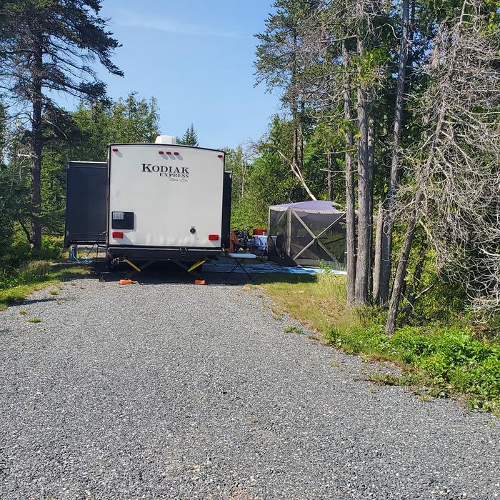 A photo of Site B18 as Viewed From The Pull-Out SideA photo of Site B18 of Loop B-Loop at Schoodic Woods Campground with Picnic Table, Electricity Hookup, Fire Pit, Water Hookup