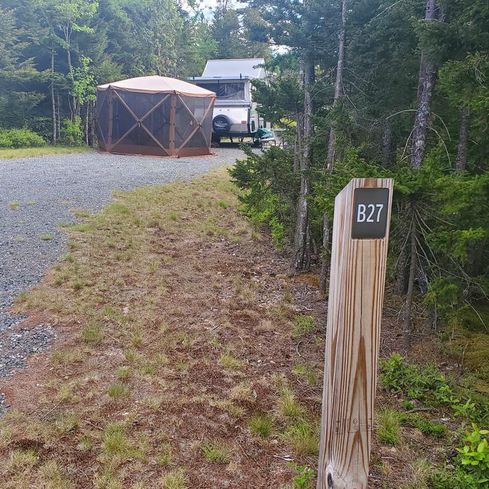 A photo of Site B27 of Loop B-Loop at Schoodic Woods Campground with Picnic Table, Electricity Hookup, Fire Pit, Water Hookup