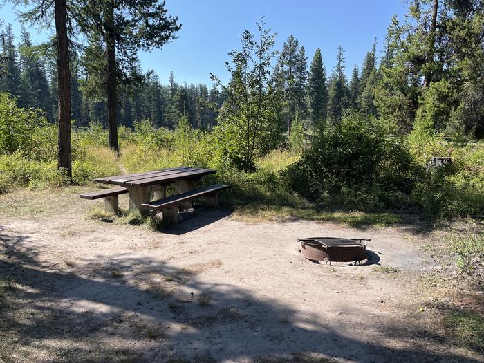 A photo of Site RPS19 at River Point Lolo Campground (MT) with Picnic Table, Fire Pit, Tent PadA photo of Site RPS19 at River Point Lolo Campground (MT) with Picnic Table, Fire Pit, Tent Pad.