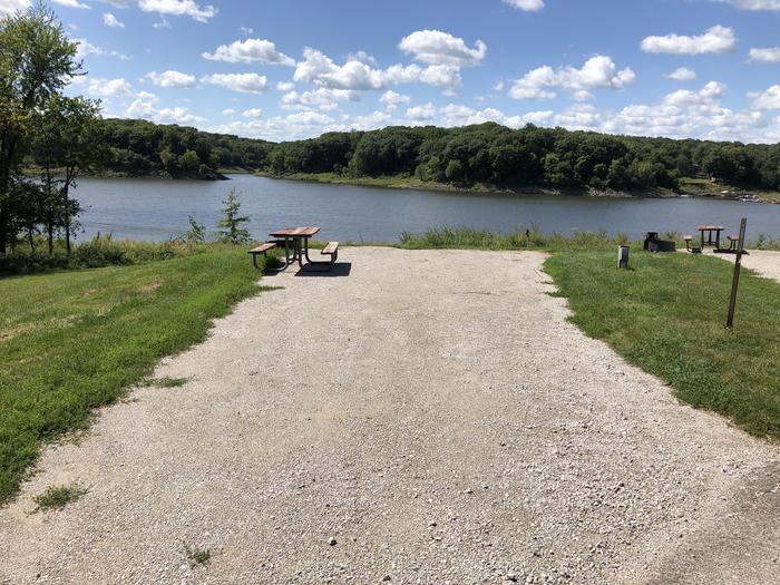 A photo of Site 031 of Loop  at SUGAR BOTTOM CAMPGROUND with Picnic Table, Electricity Hookup, Fire Pit, Waterfront