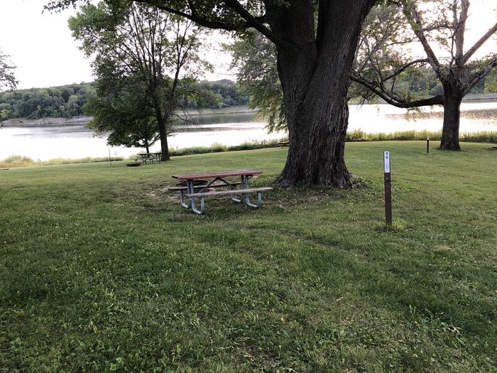 A photo of Site 099 of Loop  at SUGAR BOTTOM CAMPGROUND with Picnic Table, Fire Pit, Shade, Waterfront
