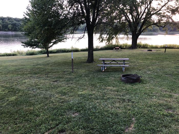 A photo of Site 102 of Loop  at SUGAR BOTTOM CAMPGROUND with Picnic Table, Fire Pit, Waterfront