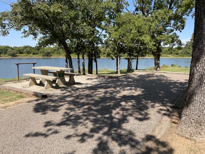 A photo of Site 10 of Loop JCRE at JOHNSON CREEK with Picnic Table, Electricity Hookup, Fire Pit, Shade, Waterfront, Water Hookup