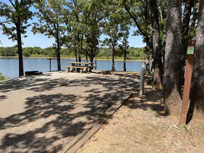 A photo of Site 06 of Loop JCRE at JOHNSON CREEK with Picnic Table, Electricity Hookup, Fire Pit, Shade, Waterfront, Water Hookup