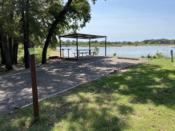 A photo of Site 17 of Loop JCRE at JOHNSON CREEK with Picnic Table, Electricity Hookup, Fire Pit, Shade, Waterfront, Water Hookup