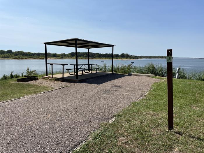 A photo of Site 16 of Loop JCRE at JOHNSON CREEK with Picnic Table, Electricity Hookup, Fire Pit, Waterfront, Water Hookup