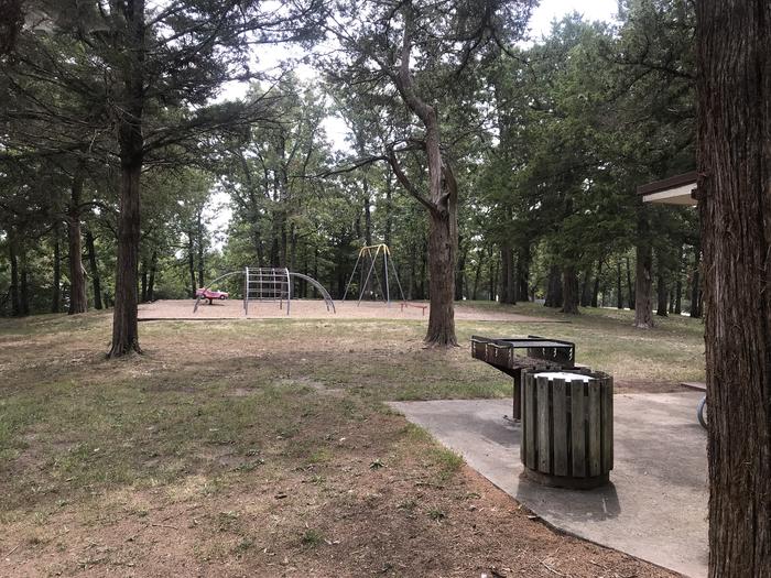 A photo or playground next to group shelter at WHEATLAND PARK
