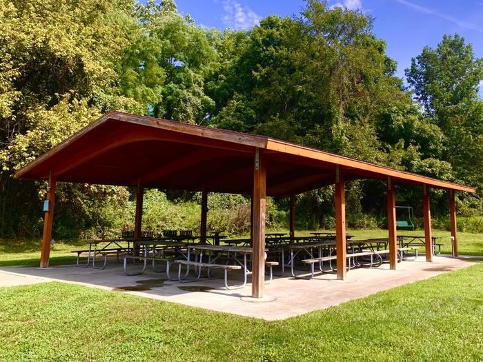 Brown open-aired wooden shelterHolly Picnic Shelter