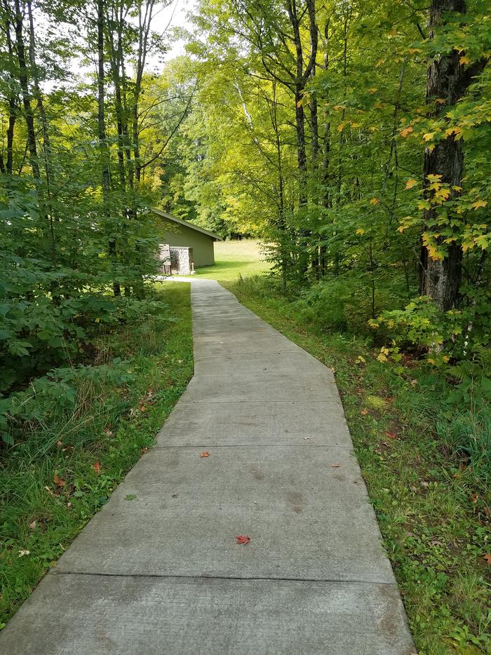 View of the accessible path down to the Clark Lake pavilion from the parking area.Path to the Clark Lake pavilion from the parking area.