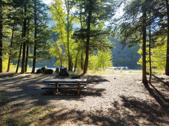 A photo of Site 13 of Loop BIG CREEK CAMPGROUND at Big Creek Campground (Flathead National Forest, MT) with Picnic Table, Fire Pit, Waterfront
