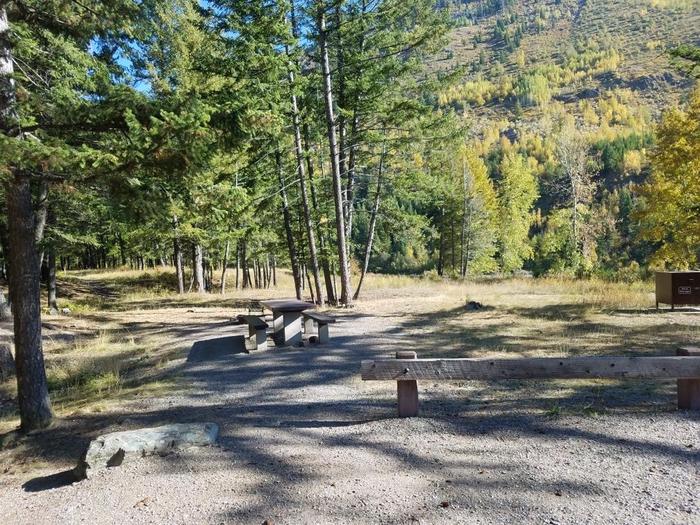 A photo of Site 17 of Loop BIG CREEK CAMPGROUND at Big Creek Campground (Flathead National Forest, MT) with Picnic Table, Fire Pit, Food Storage and extra wide driveway shared with site 16