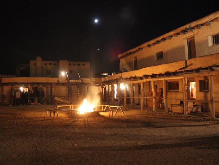 Fires light up the plaza at Bent's Old Fort
