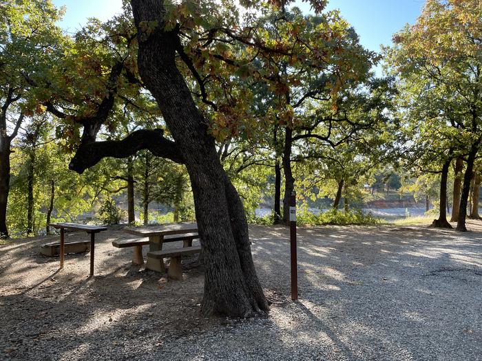 A photo of Site 16 of Loop PBEN at PRESTON BEND with Picnic Table, Electricity Hookup, Fire Pit, Shade, Waterfront, Water Hookup