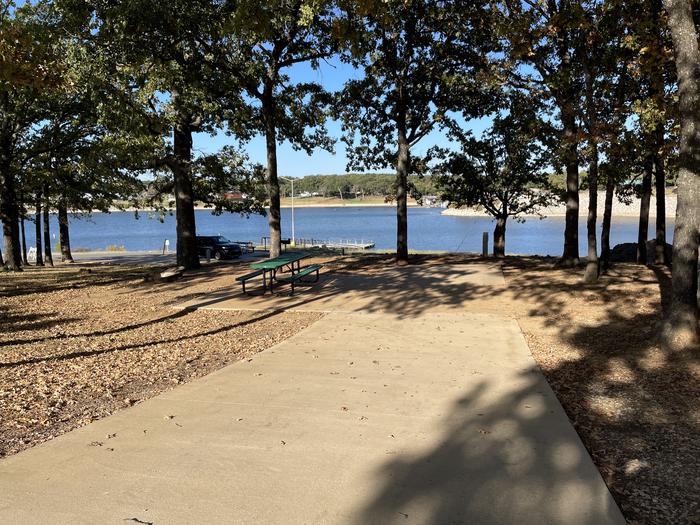 A photo of Site 30 of Loop PBEN at PRESTON BEND with Picnic Table, Electricity Hookup, Fire Pit, Shade, Waterfront, Water Hookup