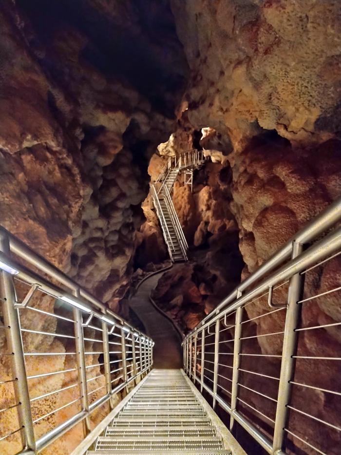 A series of stairs lining a cave passagewayBecause of the 734 stairs on the Scenic Tour, its difficulty level is considered Moderate.
