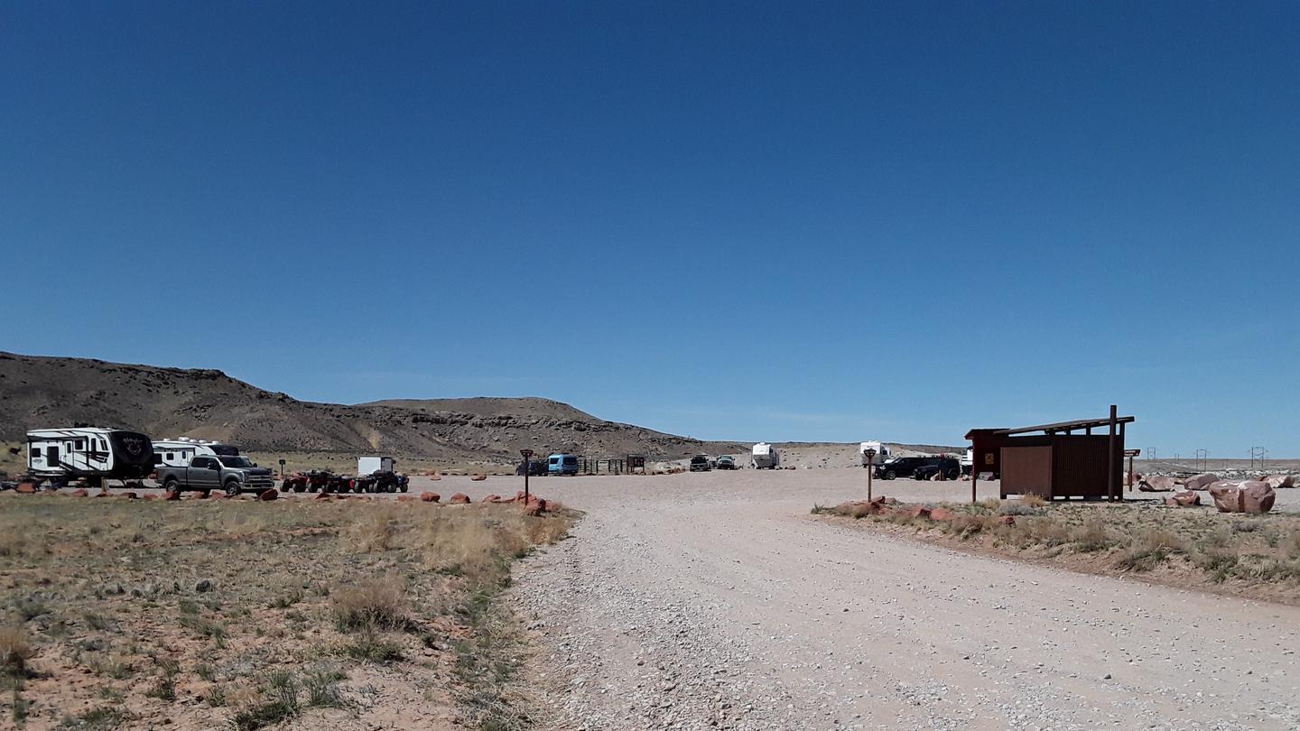 Broad view of the Courthouse Rock Campground with campsites for trailers and horse corrals