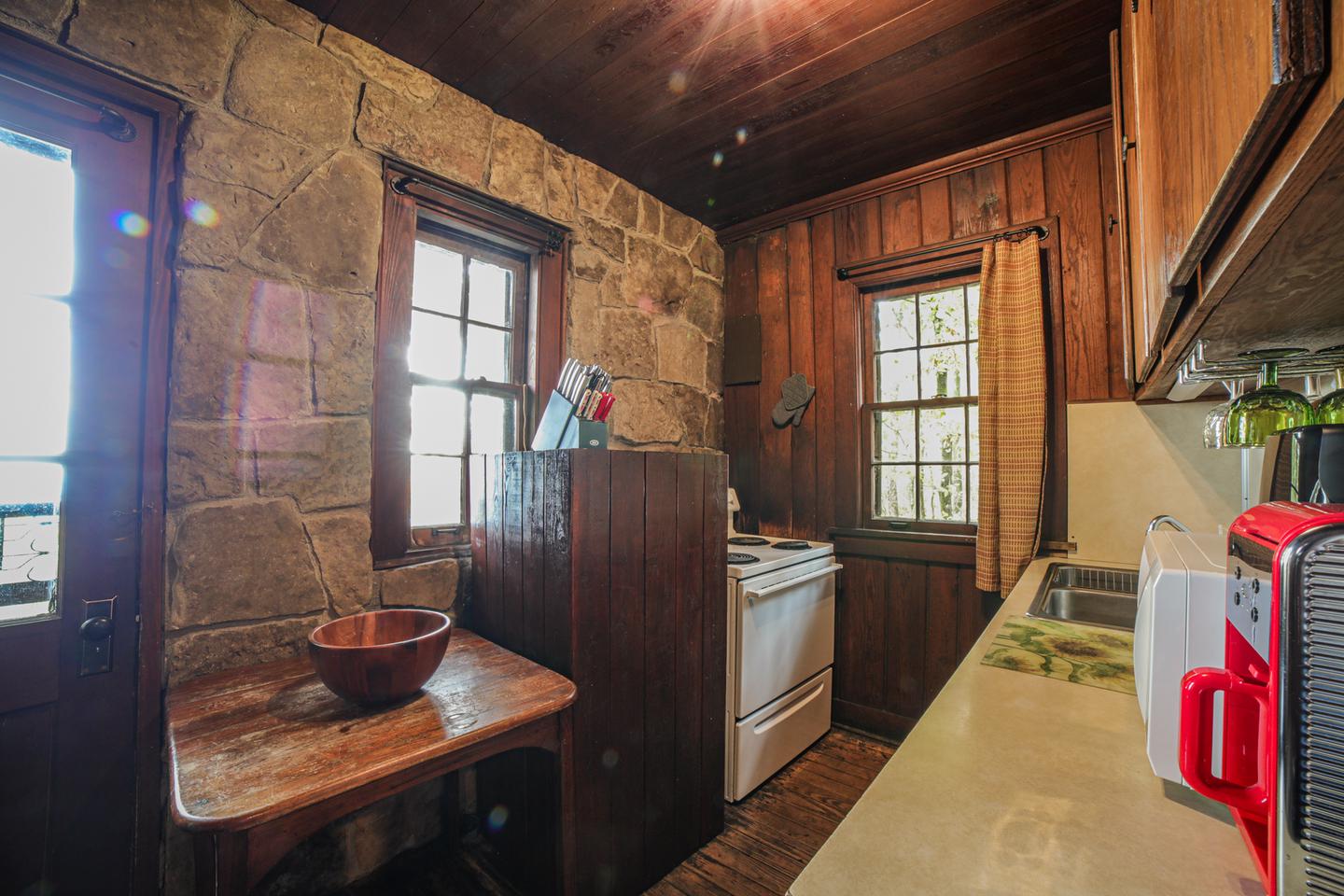 White Rock Mountain, Cabin B Kitchen.Cabin B kitchen features nice appliances, including an electric stove, refrigerator, microwave, toaster, coffee pot, crock pot, cooking utensils, pots & pans, vintage dishes, and much more!