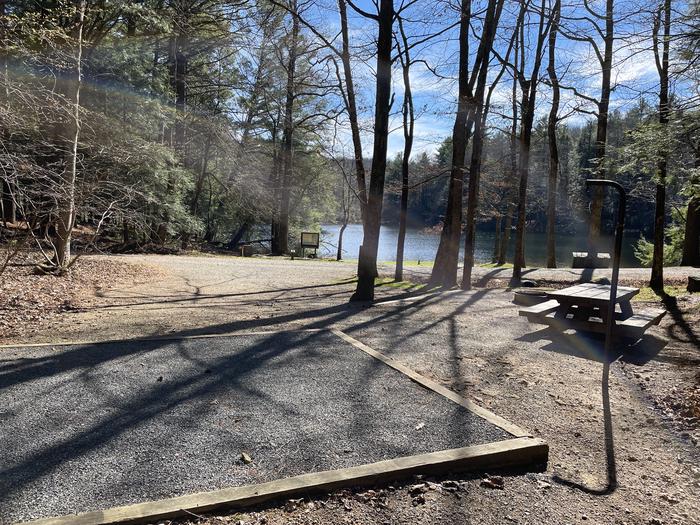 A photo of Site 23 of Loop Lower at Lake Conasauga Campground with Picnic Table, Fire Pit, Shade, Tent Pad, Lantern Pole from above.A photo of Site 23 of Loop Lower at Lake Conasauga Campground with Picnic Table, Fire Pit, Shade, Tent Pad, Lantern Pole