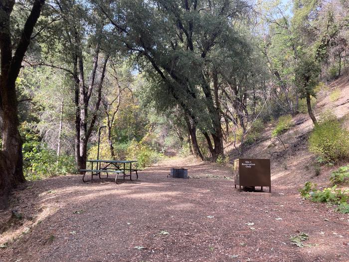 A photo of Site 01 of Loop PELTIER BRIDGE PRIMITIVE CAMPGROUND at PELTIER BRIDGE PRIMITIVE CAMPGROUND with Picnic Table, Fire Pit, Shade, Food Storage, Lantern Pole