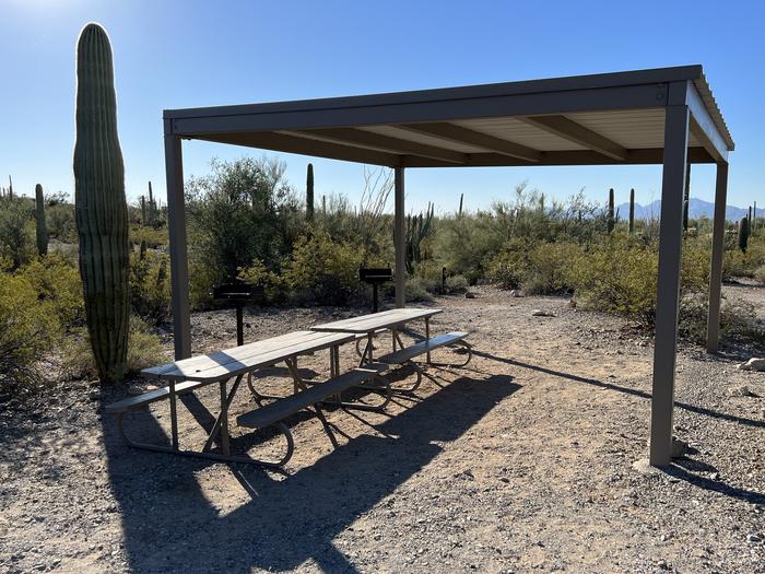 The picnic tables, grills, and shade shelterEach site has picnic tables and grills.