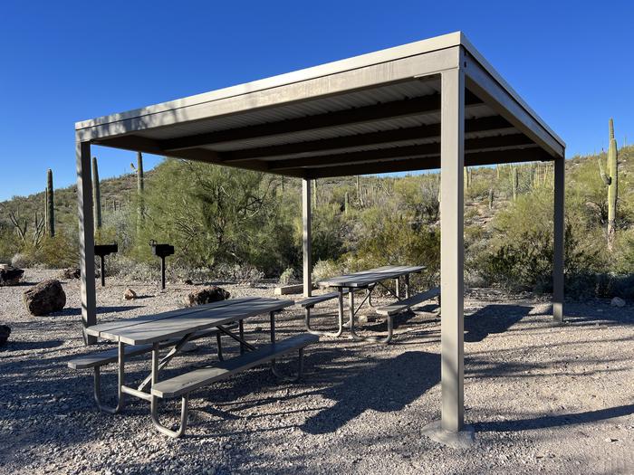 The picnic tables, grills, and shade shelter.Each site has picnic tables and grills.