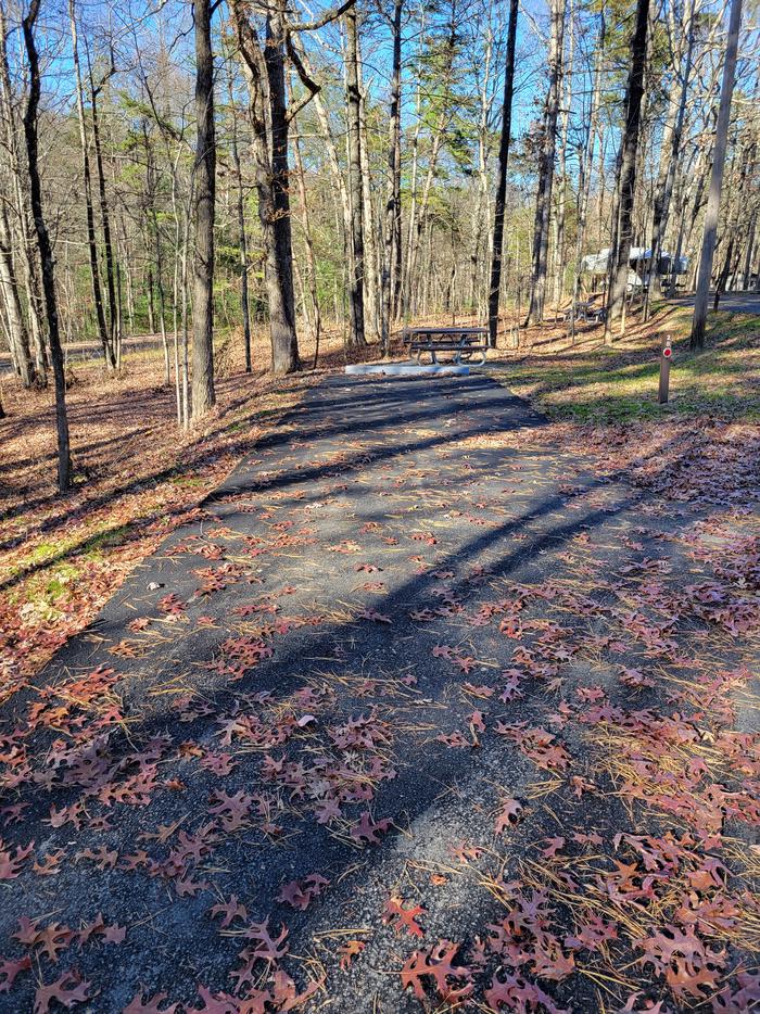 A look at the 'pull-in' style parking pad for site 28. This parking pad is not angled correctly to back in from campground road.