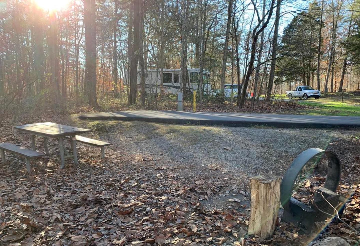 A circle fire ring and picnic table.B-9 fire ring and picnic table area.
