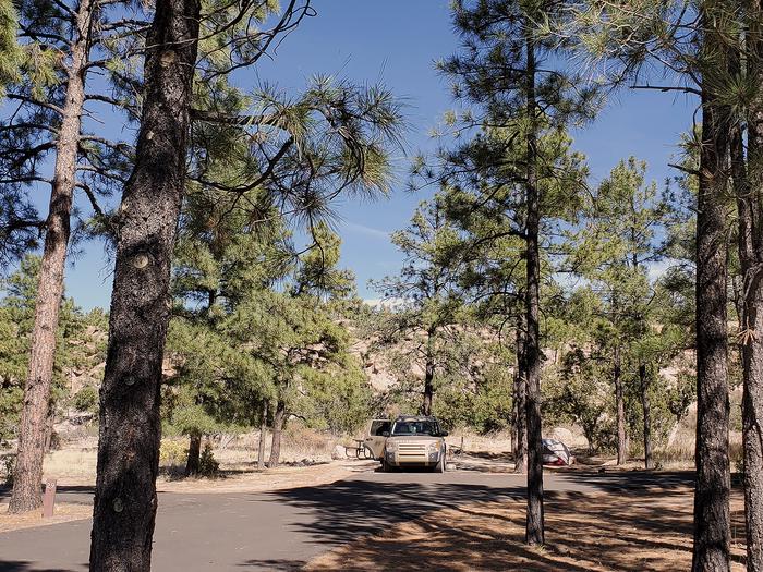 Car parked among pine treesJuniper Family Campground is located just inside the main entrance to Bandelier National Monument and is a short drive (or hike) to the park visitor center and more than 70 miles of hiking trails. 
