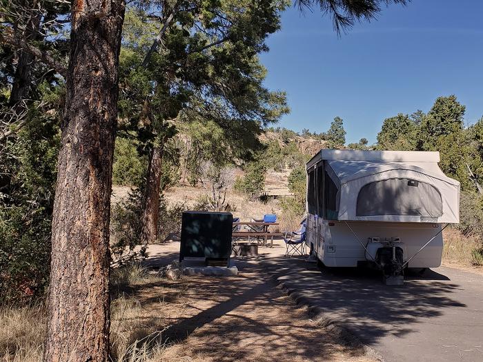 Pop-up trailer parked at a campsiteJuniper Family campground has 49 individual campsites and two group campsites. Individual campsites are all available on a first-come first-served basis. Group campsites for groups of 10-30 people, may be reserved.