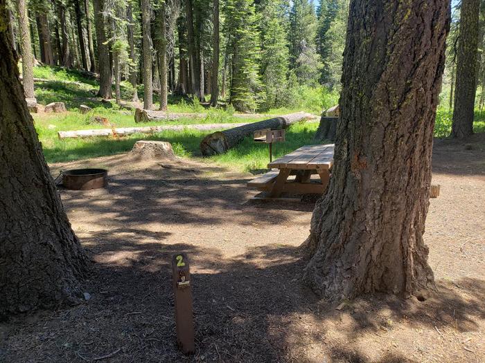 Spacious site with a mix of sun and shade that features a picnic tabe and fire ring.Grizzly Creek Site 2